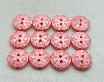 Botones rosa claro de 18 mm, juego de doce con diseño de hojas grabadas.