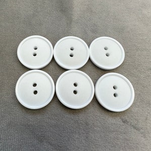 Matt buttons white border design 23mm a set of 6