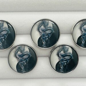 May include: Five silver-toned round buttons with a black and white yin-yang design featuring a blue dragon in the center.