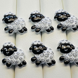 Lot de six boutons moutons 19 mm sur tige fantaisie noir et blanc