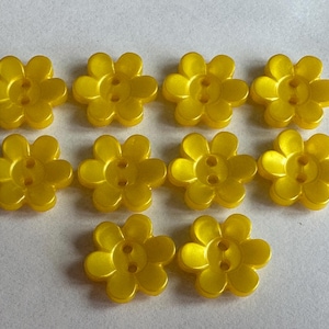 Bright yellow buttons 17mm pearlised flower design, two-hole sew-through. Sold as a set of ten buttons. For dresses, knitwear, summer gifts