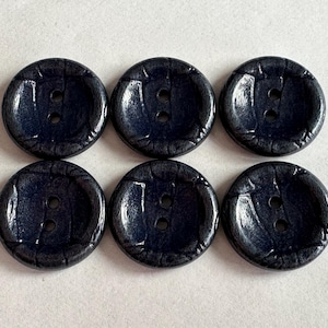 Navy buttons 23mm with a textured pearlescent finish—two-hole sew-through. Sold as a set of six buttons. Jackets, knitwear, fashion, crafts.