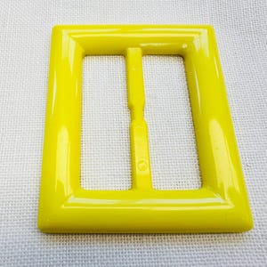 Yellow slide buckle fits a belt 50mm for coats, dresses, t shirt fastenings sold individually