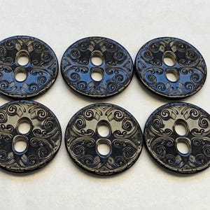 Black buttons 23mm a set of six with gold tone highlights