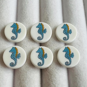 Seahorse picture buttons 14mm Blue, yellow and white on a shank by Dill. Sold as a set of six buttons. Inspired by Cornwall, cute, novelty