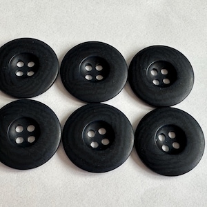 Navy blue buttons 28mm matte watermark finish, four-hole sew-through. Sold as a set of six buttons. For jackets, knitwear, homeware, crafts