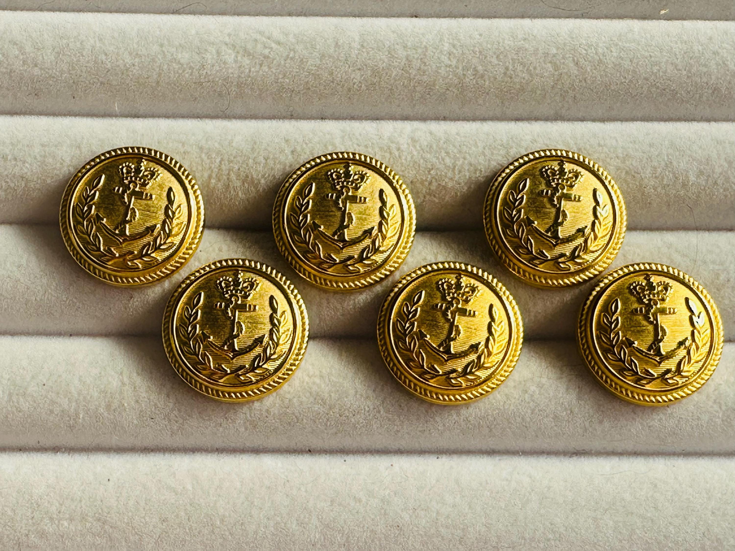 Metal buttons 20mm gold-tone anchor and wreath design on a shank. Sold as a set of six buttons. For blazers, nautical projects, costumes.