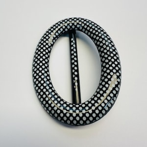 May include: A set of three ceramic mugs with a speckled, matte finish. The mugs are in shades of cream, light gray, and dark gray. Each mug has a simple, minimalist design, perfect for coffee or tea.