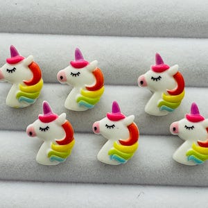 Unicorn buttons 16mm bright colours on a white background fun novelty design sold as a set of six buttons