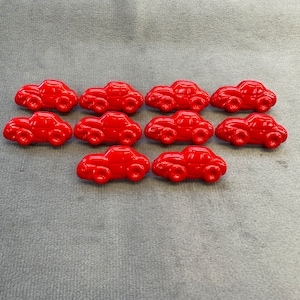 Sports car buttons red 28mm x 18mm a set of 10