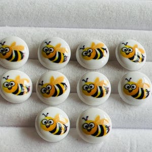 Bee picture buttons 15mm, cute design in yellow and black on a white background with a shank. Sold as a set of ten buttons, knitwear, crafts