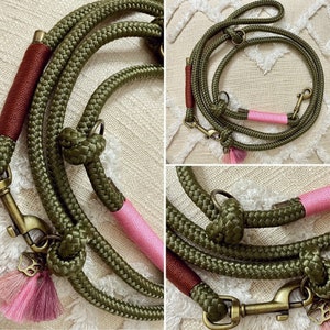 May include: A green and pink dog leash with a tassel. The leash is made of thick rope and has a metal clasp.