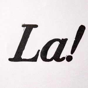 La! hand-printed A5 linocut — charity print