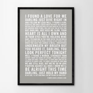May include: A gray and white printable wedding sign with the lyrics to the song "I Found a Love for Me" by The Wedding Present. The text includes the lyrics, "I found a love for me, darling just dive right in and follow my lead..." and the date and location of the wedding, "St. Mary's Church, Saturday 22 June."