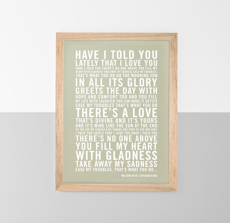 May include: A framed print with a light green background and white text. The text is a song lyric that reads "Have I told you lately that I love you..." The print is in a wooden frame.