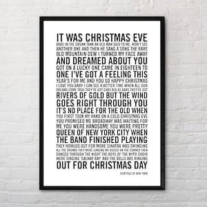 May include: Black and white printable wall art featuring the lyrics to the song "Fairytale of New York" by The Pogues and Kirsty MacColl. The lyrics are printed in a bold, sans-serif font.