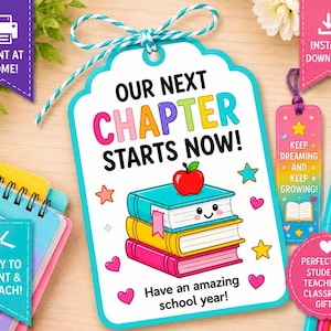 May include: A rectangular gift tag with a teal border and blue and white string, featuring the text "OUR NEXT CHAPTER STARTS NOW!" above a stack of three colorful books with a red apple on top and the text "Have an amazing school year!"