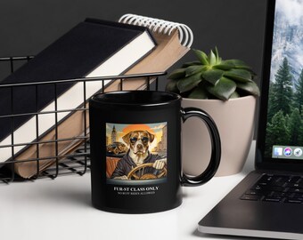 May include: Black coffee mug with a graphic of a dog wearing sunglasses and driving a car. The text on the mug reads "Fur-st Class Only No Ruff Rides Allowed."