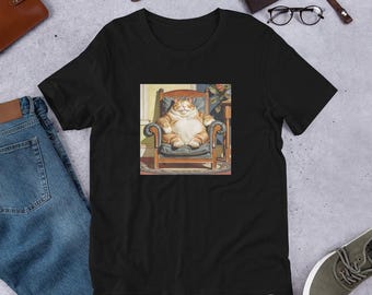 May include: A black t-shirt with a graphic of a large orange tabby cat sitting in a brown armchair. The cat is wearing a relaxed expression and has a large belly.