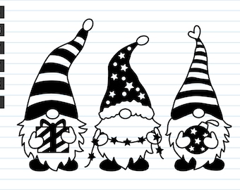 May include: Three black and white gnomes with different hats. The gnome on the left is holding a striped gift box. The gnome in the middle is wearing a hat with stars and is holding a string of lights. The gnome on the right is holding a star-shaped ornament.
