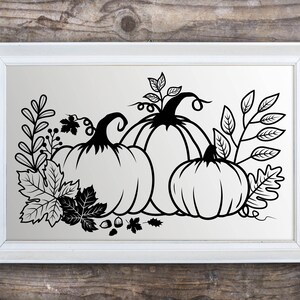 May include: A black and white silhouette of three pumpkins with leaves and vines. The pumpkins are arranged in a cluster, with the largest pumpkin in the back and the smallest pumpkin in the front. The leaves and vines are arranged around the pumpkins, creating a festive autumnal scene.