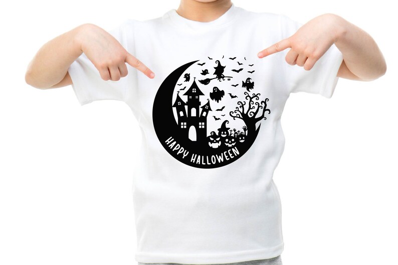 May include: White t-shirt with a black graphic of a crescent moon, a haunted house, a witch flying on a broomstick, bats, ghosts, and a tree. The text "Happy Halloween" is written around the moon.