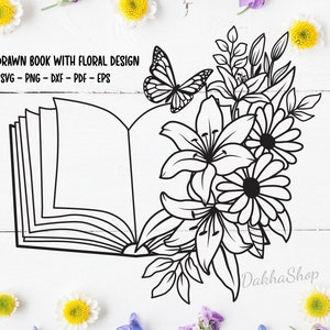 May include: A black and white line drawing of an open book with flowers and a butterfly. The text "HAND DRAWN BOOK WITH FLORAL DESIGN" and "SVG - PNG - DXF - PDF - EPS" is below the book. The text "Dakha Shop" is at the bottom right of the image.