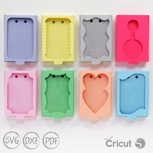 May include: Eight different card-sized boxes with various shapes and colors. The boxes have a cut-out window and two holes for string or ribbon. The boxes are perfect for packaging small gifts or favors.