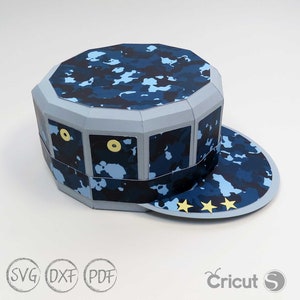 May include: A blue and gray papercraft hat with a camouflage pattern and three gold stars on the brim. The hat is designed to be assembled from a paper model.