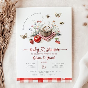 May include: Baby shower invitation featuring a picnic theme. The invitation includes the text "baby shower" in a script font, along with the names "Olivia & David". The design incorporates watercolor illustrations of a picnic basket, fruit, flowers, and butterflies. The date is April 16.
