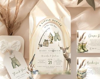 May include: A baby shower invitation with a woodland theme. The invitation features a watercolor illustration of a deer, fishing rod, and fishing gear. The text on the invitation reads "A Little Hunter is on the way" and includes the date and time of the shower. There are also two additional cards for a diaper raffle and books for baby.