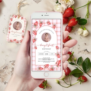 May include: A digital invitation for a first birthday party with a strawberry theme. The invitation features a pink and white gingham background with watercolor strawberries and a photo of a baby girl. The text on the invitation reads "Please join us for Kylie's Berry First Birthday, Saturday, September 23, 3-4pm, Kylie's House, Garcia Residence 13447 2nd Ave, Lyfold TX 78589, RSVP to Pat by 4th of November at 987 654 343."