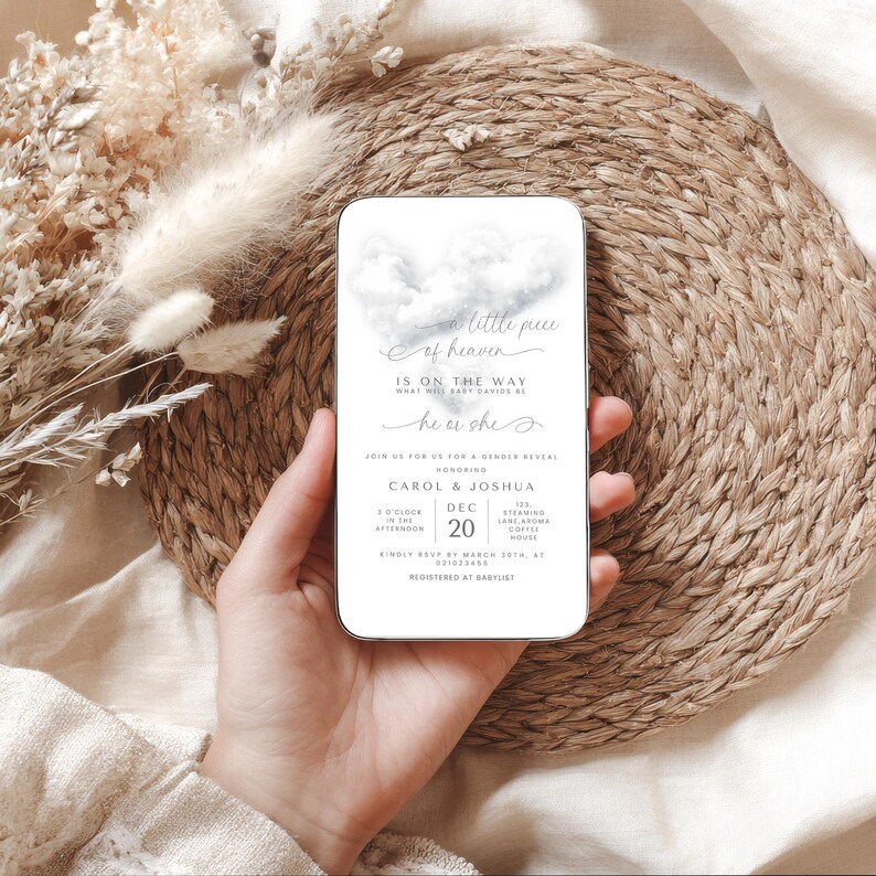 May include: A rectangular invitation card with rounded corners, featuring a cloud design and the text "a little piece of heaven." The card includes details for a gender reveal event, with the names Carol & Joshua, and the date December 20th.