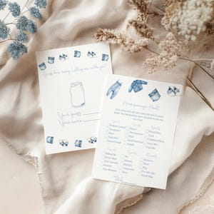 May include: Two white cards with blue watercolor illustrations and text. One card says "Guess how many Lollies are in the jar?" The other says "Home scavenger hunt!" with a checklist of items.