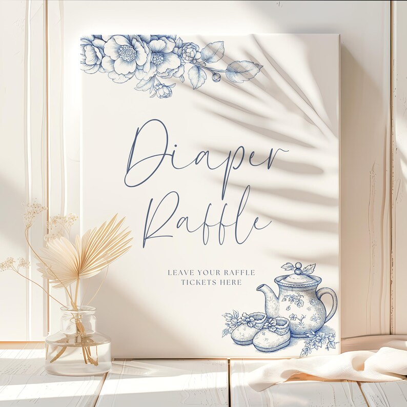 May include: A white sign with blue floral designs and the text "Diaper Raffle" and "Leave your raffle tickets here".  The sign also features a blue teapot and two blue baby shoes.