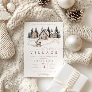 May include: A baby shower invitation with a watercolor village scene, featuring houses, trees, and a stroller on a snowy path. The text reads "it takes a VILLAGE" and includes event details. The invitation is surrounded by winter-themed decorations.