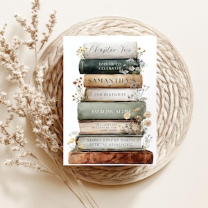 May include: A birthday invitation card with a stack of books design. The text reads "Chapter Two", "Join us to Celebrate Samantha's 2nd Birthday", along with the date, time, and RSVP details. Floral elements are included.