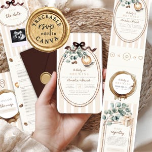 May include: A digital baby shower invitation template featuring a coffee theme with a latte art illustration, eucalyptus leaves, and a brown ribbon. The design includes text such as A Baby is Brewing, Amelia & David, and registry details on a beige striped background.