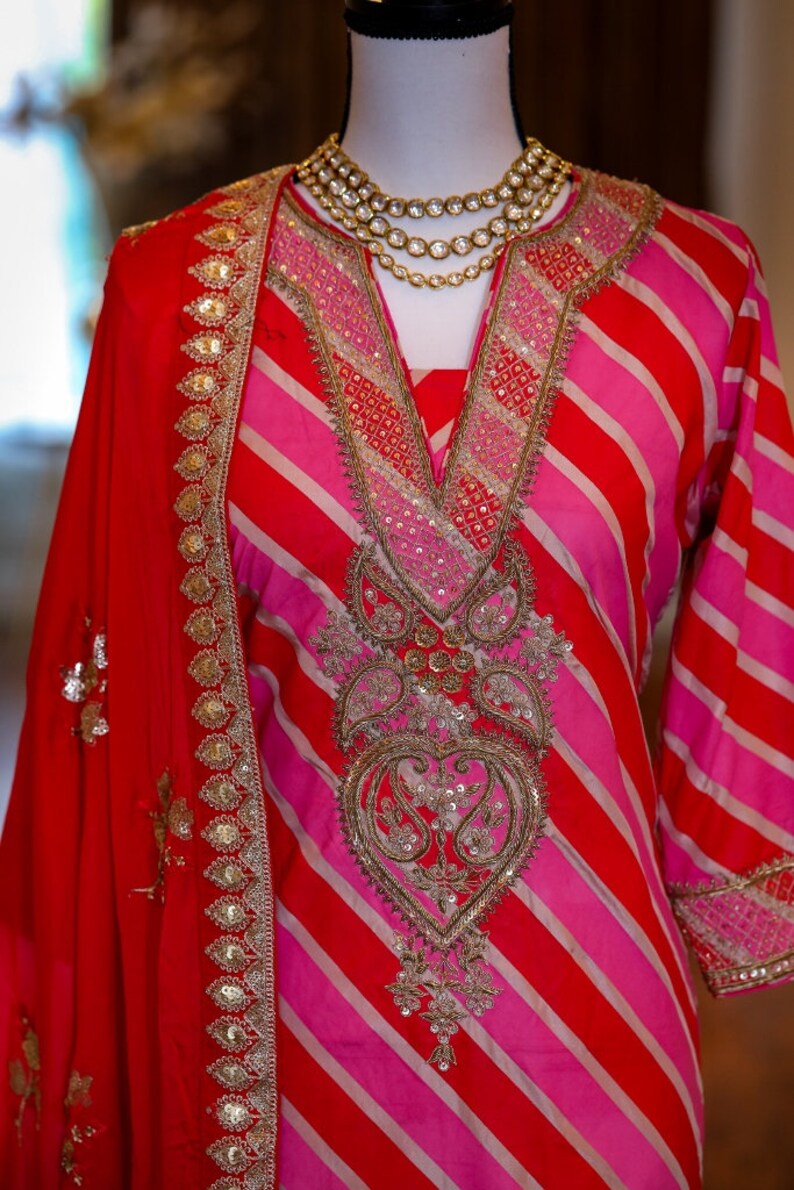 Lehereya kurta hand painted to form the lehereya pattern; adorned with intricate ari and sequin hand work.