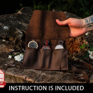 May include: Brown leather watch roll with three slots for watches. The roll is open and three watches are visible. The watches are made of wood and have different colored bands. The roll has a strap and is sitting on a tree stump. The text "INSTRUCTION IS INCLUDED" is visible at the bottom of the image.