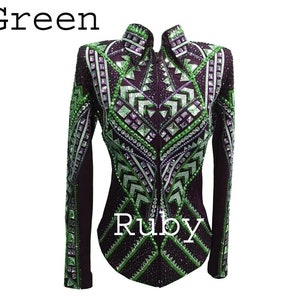 May include: A long-sleeved jacket in deep purple featuring a high collar and a front zipper. The garment is heavily embellished with geometric patterns of green and clear crystals, sequins, and studs. The text Green and Ruby appears on the image.
