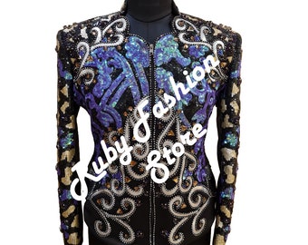 May include: A black sequined jacket with a zipper closure. The jacket features a purple and teal floral design with gold accents. The text "Ruby Fashion Store" is printed on the front of the jacket.
