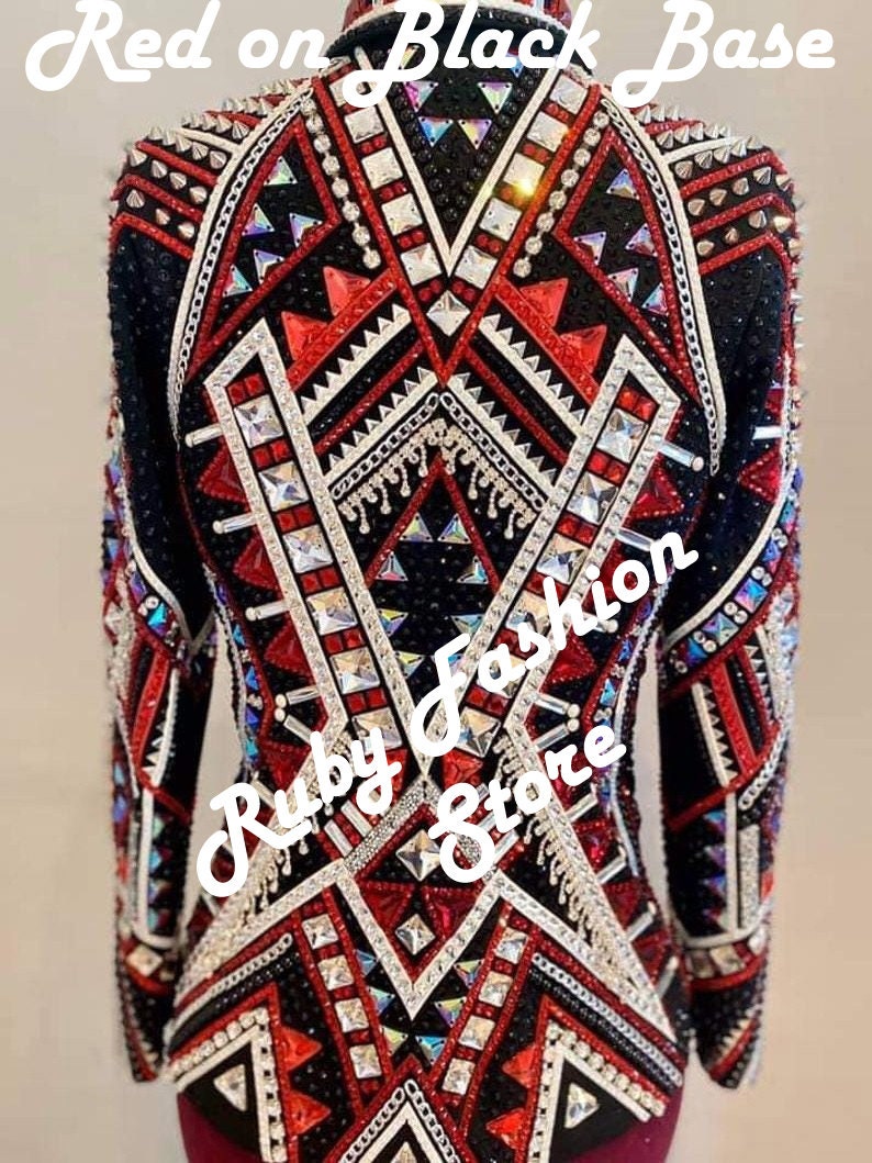 May include: A long-sleeved jacket featuring a black base with intricate red and white geometric patterns, heavily embellished with silver studs, clear crystals, and metallic chains. The text "Red on Black Base" and "Ruby Fashion Store" is visible.