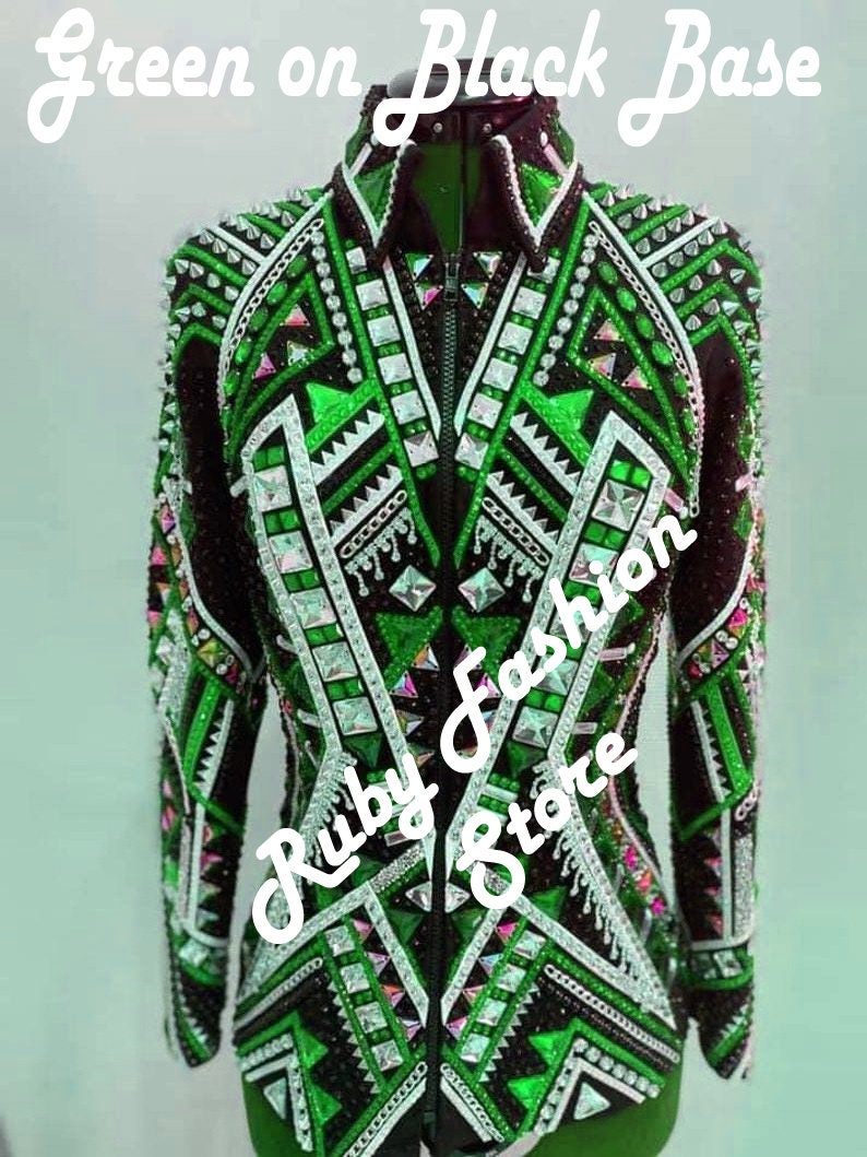 May include: A black long-sleeve jacket featuring vibrant green geometric patterns, silver metallic accents, and numerous clear crystals. The front includes a central zipper closure and the text "Green on Black Base" and "Ruby Fashion Store".