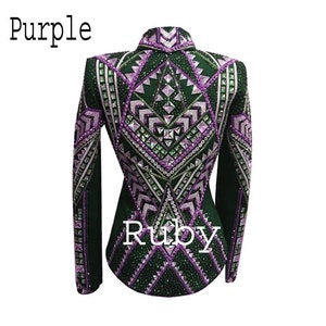 May include: A dark green long-sleeved jacket featuring intricate geometric patterns in purple and white, heavily embellished with numerous crystals and studs. The text "Purple" and "Ruby" is printed on the image. The jacket has a high collar.