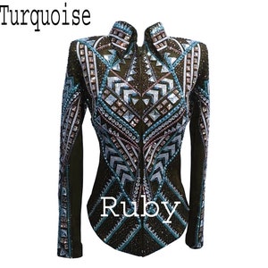 May include: A dark brown long-sleeved jacket featuring a high collar, a full-length front zipper, and intricate geometric patterns embellished with turquoise, silver, and clear crystals. The text Turquoise and Ruby appear on the image.