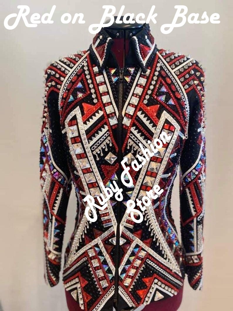 May include: A black jacket with a front zipper, featuring intricate red and white geometric patterns, silver studs, and numerous clear and red crystals. The text 'Red on Black Base' and 'Ruby Fashion Store' is overlaid on the image.