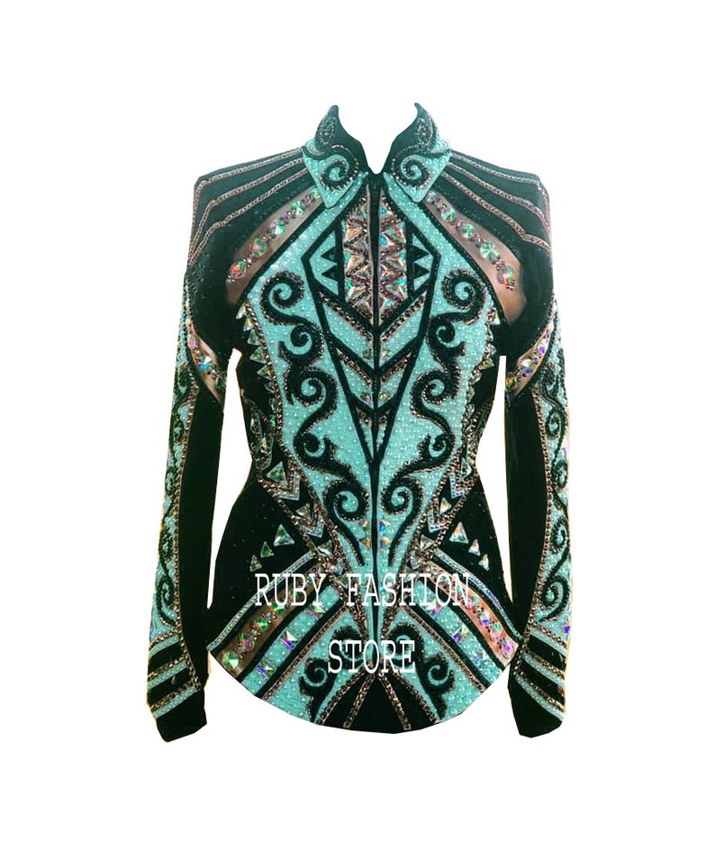 May include: A black long-sleeved shirt featuring a high collar, a front zipper, and intricate turquoise and black scrollwork patterns. The garment is heavily embellished with iridescent crystals and includes the text RUBY FASHION STORE.