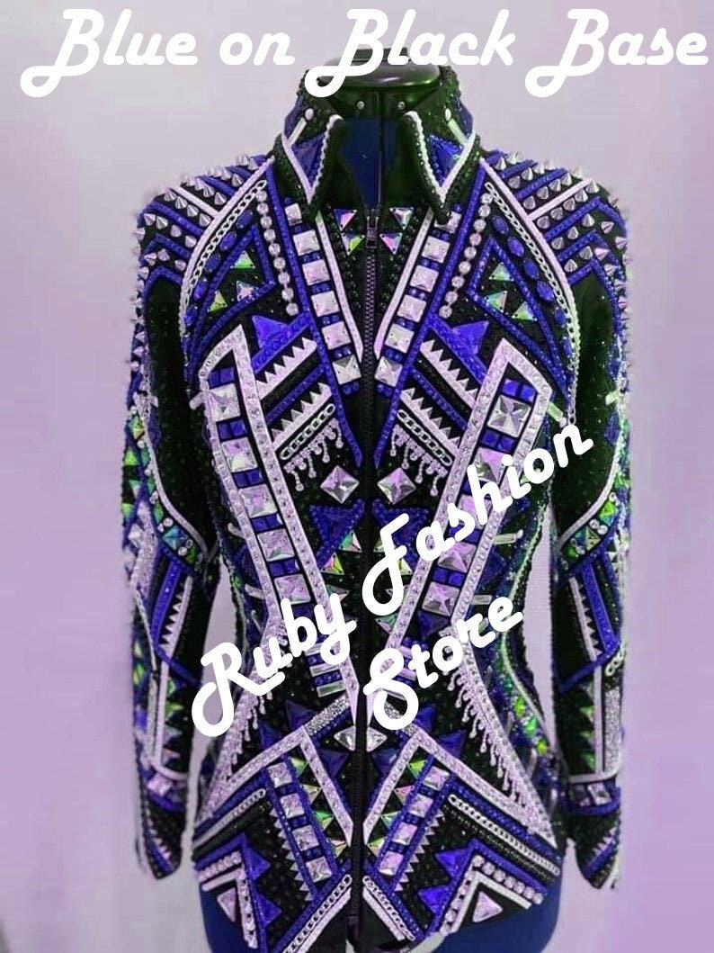 May include: A black long-sleeve jacket featuring a high collar and a front zipper. The garment is heavily embellished with blue, purple, and clear crystals in geometric patterns. Text on the image reads Blue on Black Base and Ruby fashion Store.