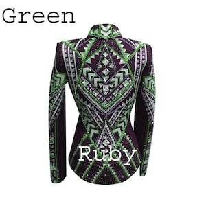 May include: A long-sleeved jacket in deep purple featuring an intricate geometric pattern embellished with numerous green and clear crystals. The garment displays the text Green at the top left and Ruby at the bottom center, with structured shoulders.